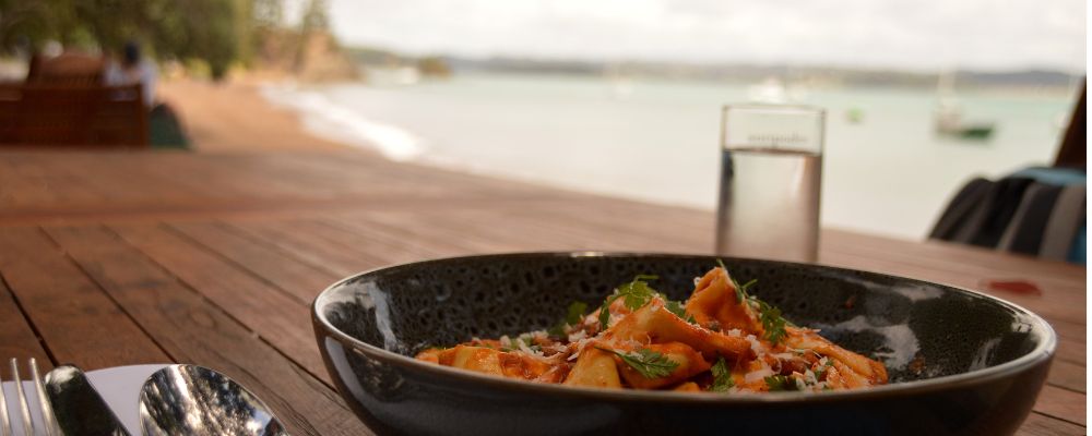 Plate of food in front of water